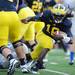 Michigan senior quarterback Denard Robinson losses his footing as he runs the ball during the first quarter against Air Force game at Michigan Stadium on Saturday. Melanie Maxwell I AnnArbor.com